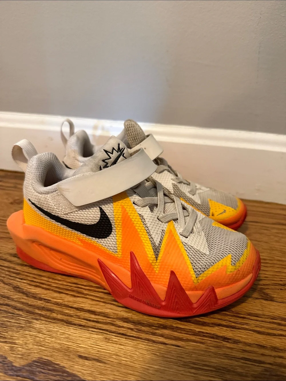 Nike Kids' Gray Sneakers with Orange and Red Lightning Accents